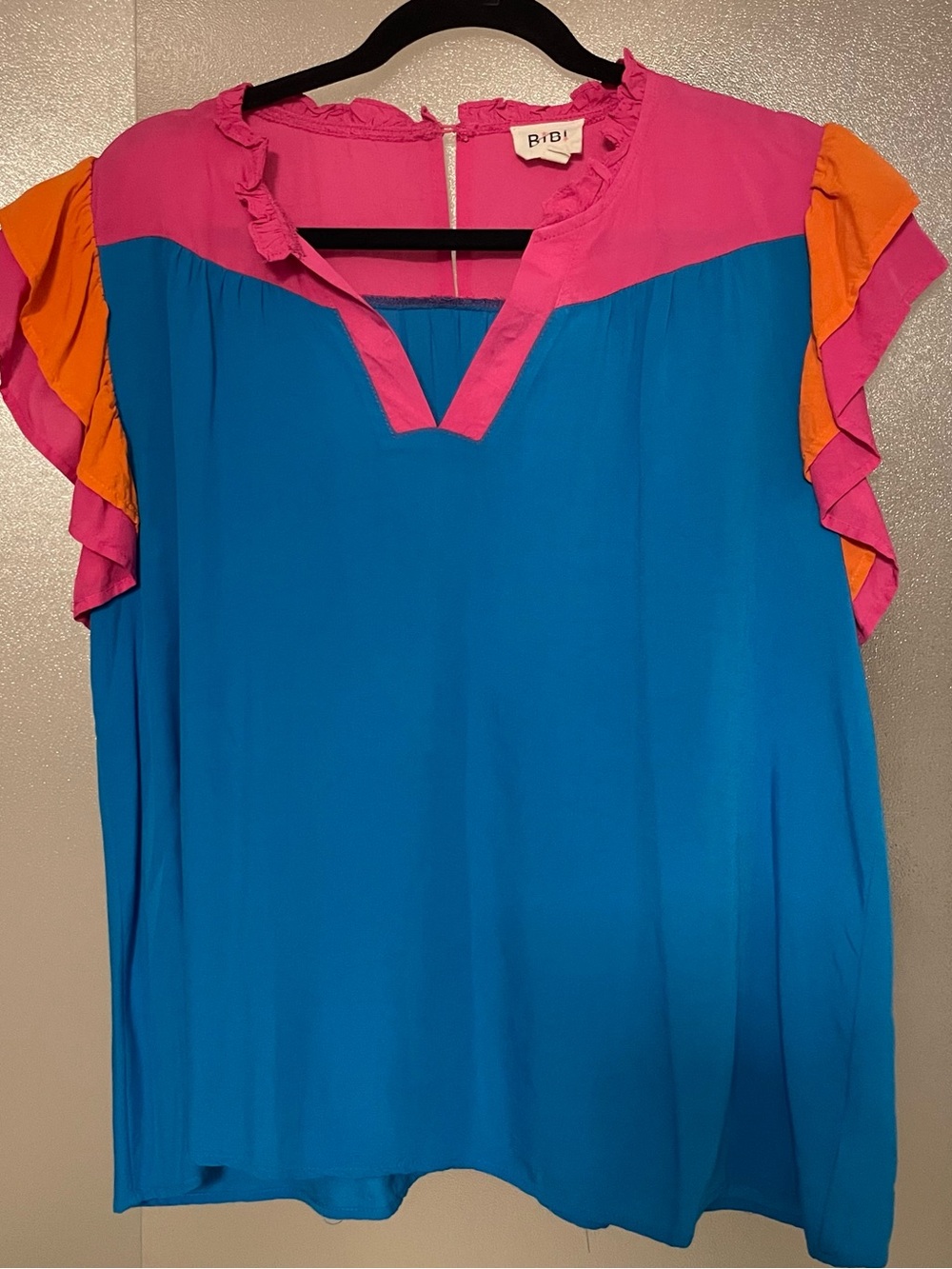 BiBi Blue Top with Pink Yoke and Orange Ruffle Sleeves